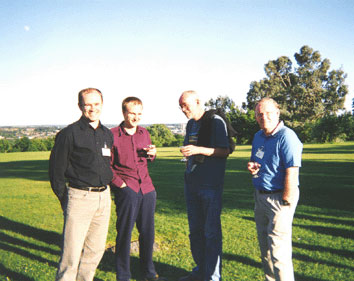 Photo (30KB): At the wine reception: enjoying a glass or two in the sunshine