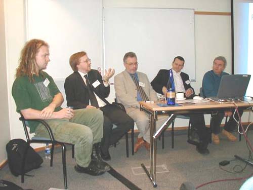 photo (39KB) : Question Time: Chris Gutteridge, Chris Awre, Laurence Bebbington, Neil Jacobs and Philip Hunter answering questions from the floor.